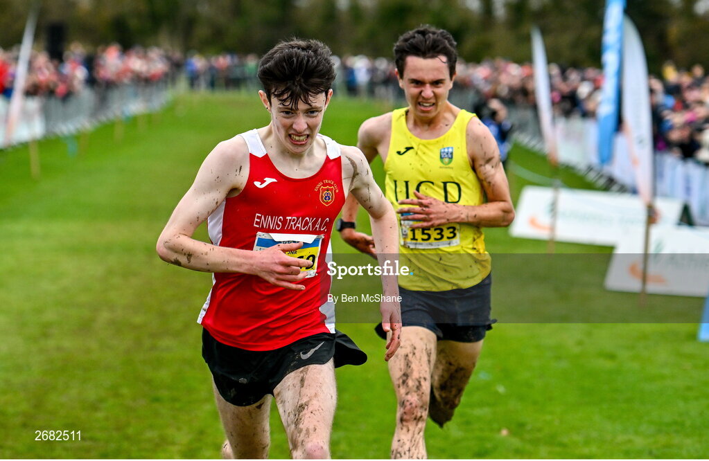 19 November 2023; Niall Murphy of Ennis Track AC, Clare, left, and Jonas Stafford of UCD AC, Dublin, race for the finish line in the Mens U18 & Junior 5000m during the 123.ie National Senior & Even Age Cross Country Championships at Gowran Demesne in Kilkenny. Photo by Ben McShane/Sportsfile