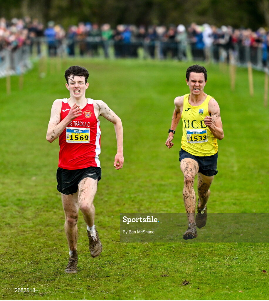 19 November 2023; Niall Murphy of Ennis Track AC, Clare, left, and Jonas Stafford of UCD AC, Dublin, race for the finish line in the Mens U18 & Junior 5000m during the 123.ie National Senior & Even Age Cross Country Championships at Gowran Demesne in Kilkenny. Photo by Ben McShane/Sportsfile
