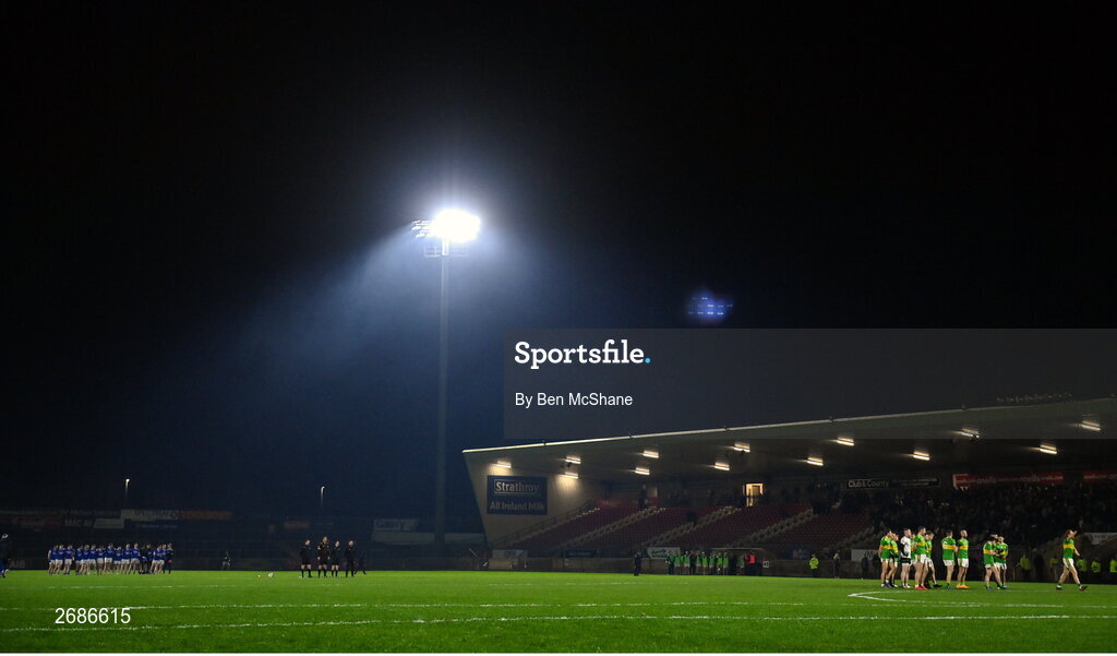 25 November 2023; Players of both sides stand for Amhrán na bhFiann before the AIB Ulster GAA Football Senior Club Championship semi-final match between Glen, Derry, and Naomh Conaill, Donegal, at Healy Park in Omagh, Tyrone. Photo by Ben McShane/Sportsfile