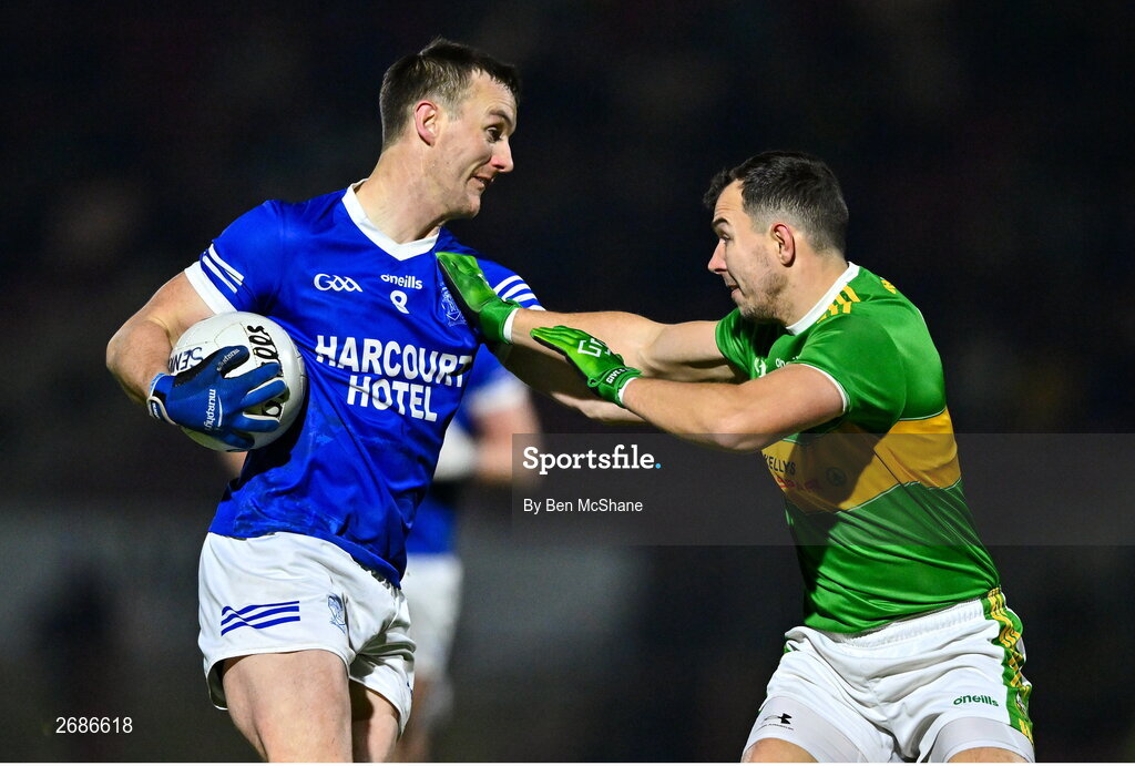 25 November 2023; Leo McLoone of Naomh Conaill in action against Michael Warnock of Glen during the AIB Ulster GAA Football Senior Club Championship semi-final match between Glen, Derry, and Naomh Conaill, Donegal, at Healy Park in Omagh, Tyrone. Photo by Ben McShane/Sportsfile