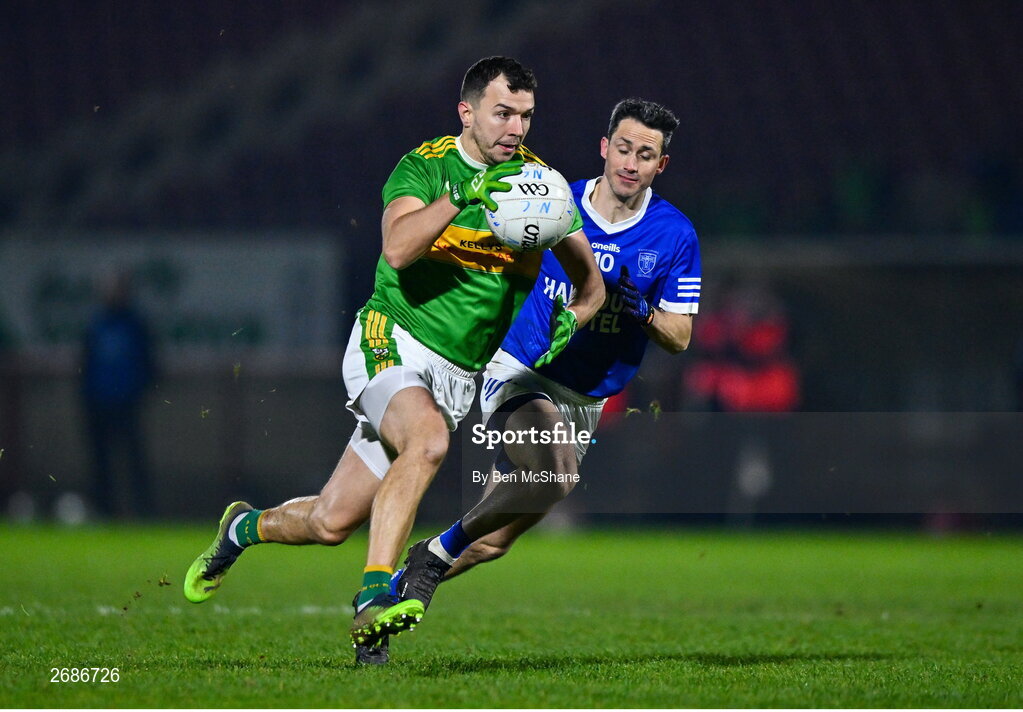 25 November 2023; Michael Warnock of Glen in action against Brendan McDyer of Naomh Conaill during the AIB Ulster GAA Football Senior Club Championship semi-final match between Glen, Derry, and Naomh Conaill, Donegal, at Healy Park in Omagh, Tyrone. Photo by Ben McShane/Sportsfile
