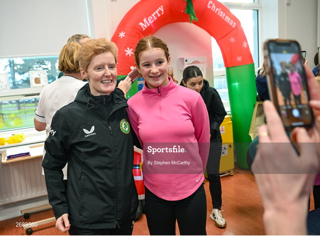 27 Novmeber 2023; Republic of Ireland's interim head coach Eileen Gleeson with Elsie Friel, from Drumkeen, Donegal, a member of the Ireland women's CP team, during a visit to Cappagh Kids and The National Orthopaedic Hospital Cappagh in Dublin to launch the Cappagh Hospital Foundation Christmas Appeal and their fundraising ambassador Boney Maloney. Photo by Stephen McCarthy/Sportsfile