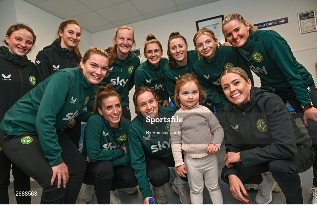 27 Novmeber 2023; Republic of Ireland's players, back row, from left, Freya Healy, Ellen Dolan, Courtney Brosnan, Sinead Farrelly, Lucy Quinn, Hayley Nolan and Erin McLaughlin; front row, from left, Saoirse Noonan, Chloe Mustaki, Heather Payne, and Denise O'Sullivan, with Duvheasa Finneran, age 2, from Toberconor, Roscommon, during a visit to Cappagh Kids and The National Orthopaedic Hospital Cappagh in Dublin to launch the Cappagh Hospital Foundation Christmas Appeal and their fundraising ambassador Boney Maloney. Photo by Ramsey Cardy/Sportsfile