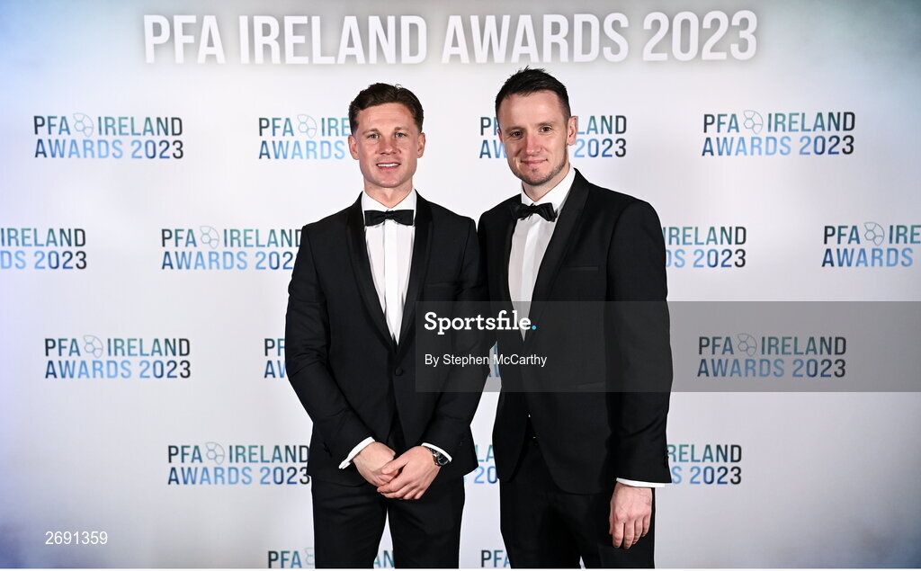 2 December 2023; Recently retired Shelbourne captain Luke Byrne, left, and PFA Ireland chairperson Brendan Clarke on arrival at the PFA Ireland Awards 2023 at Anantara The Marker Dublin Hotel in Dublin. Photo by Stephen McCarthy/Sportsfile