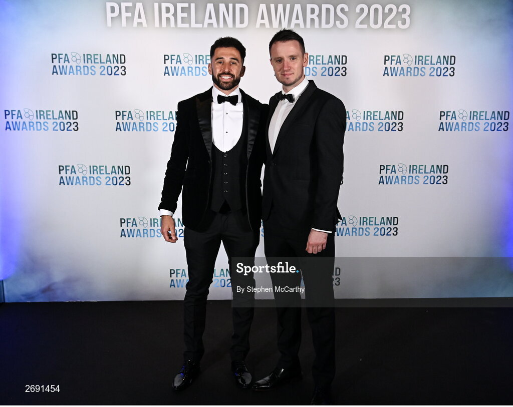 2 December 2023; Roberto Lopes of Shamrock Rovers, left, and PFA Ireland chairperson Brendan Clarke during the PFA Ireland Awards 2023 at Anantara The Marker Dublin Hotel in Dublin. Photo by Stephen McCarthy/Sportsfile