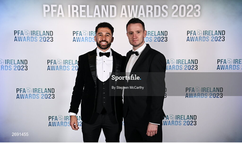 2 December 2023; Roberto Lopes of Shamrock Rovers, left, and PFA Ireland chairperson Brendan Clarke during the PFA Ireland Awards 2023 at Anantara The Marker Dublin Hotel in Dublin. Photo by Stephen McCarthy/Sportsfile