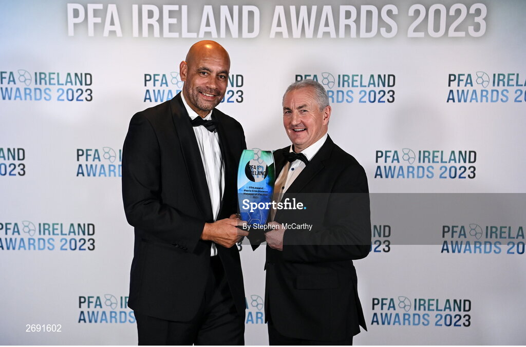 2 December 2023; Republic of Ireland U16 manager Paul Osam, left, presents Galway United manager John Caulfield with the PFA Ireland Men's First Division Manager of the Year award during the PFA Ireland Awards 2023 at Anantara The Marker Dublin Hotel in Dublin. Photo by Stephen McCarthy/Sportsfile