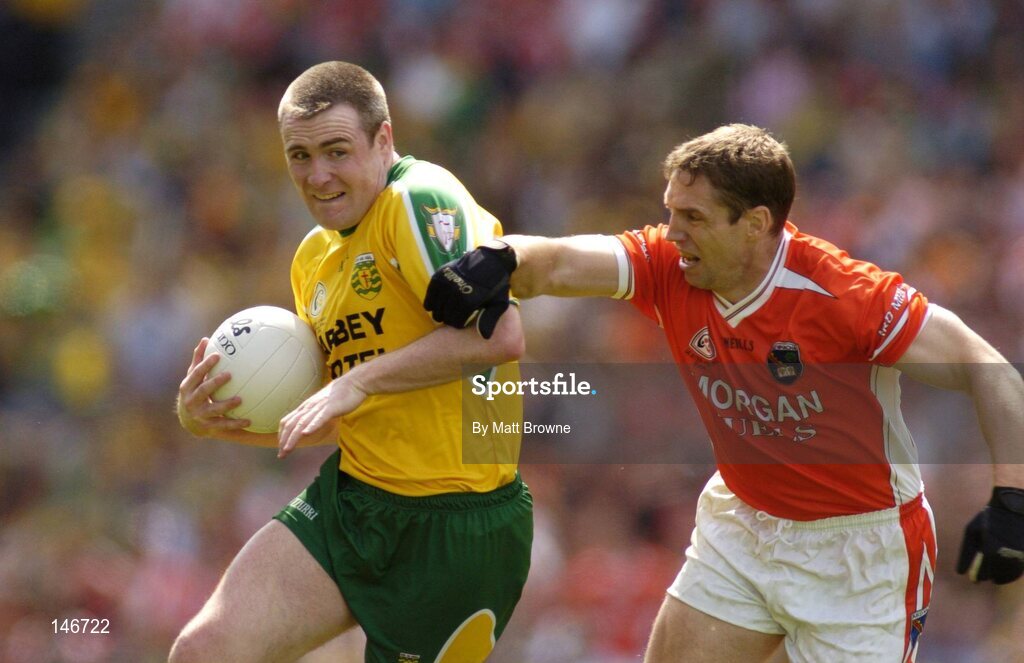 11 July 2004; John Gildea, Donegal, is tackled by Kieran McGeeney, Armagh. Bank of Ireland Ulster Senior Football Championship Final, Armagh v Donegal, Croke Park, Dublin. Picture credit; Matt Browne / SPORTSFILE