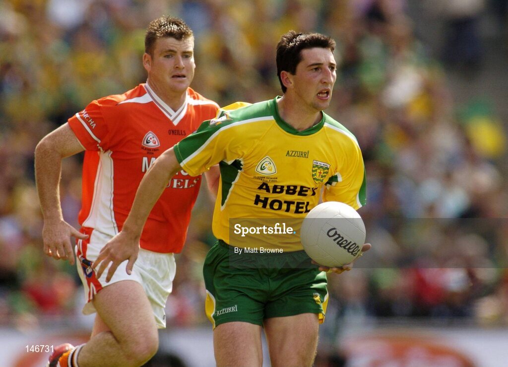 11 July 2004; Michael Hegarty, Donegal, is persued by Kieran Hughes, Armagh, left. Bank of Ireland Ulster Senior Football Championship Final, Armagh v Donegal, Croke Park, Dublin. Picture credit; Matt Browne / SPORTSFILE