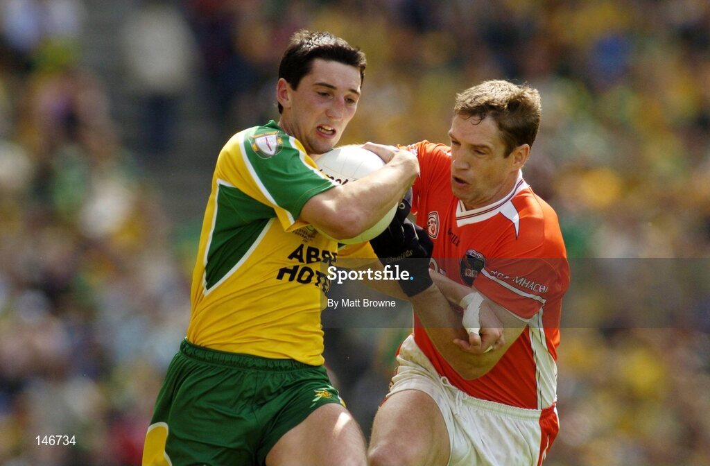 11 July 2004; Michael Hegarty, Donegal, is tackled by Kieran McGeeney, Armagh. Bank of Ireland Ulster Senior Football Championship Final, Armagh v Donegal, Croke Park, Dublin. Picture credit; Matt Browne / SPORTSFILE