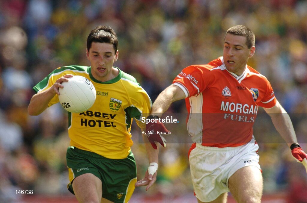 11 July 2004; Michael Hegarty, Donegal, is tackled by Diarmuid Marsden, Armagh. Bank of Ireland Ulster Senior Football Championship Final, Armagh v Donegal, Croke Park, Dublin. Picture credit; Matt Browne / SPORTSFILE