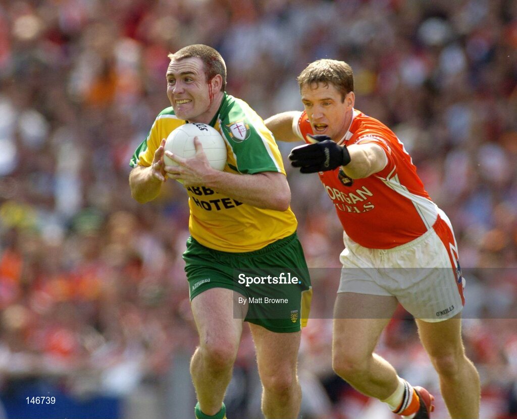 11 July 2004; John Gildea, Donegal, with blood on his face from a head wound, is tackled by Kieran McGeeney, Armagh. Bank of Ireland Ulster Senior Football Championship Final, Armagh v Donegal, Croke Park, Dublin. Picture credit; Matt Browne / SPORTSFILE
