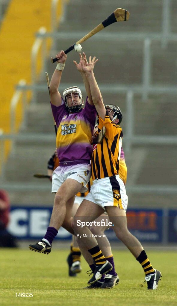 14 July 2004; Cronan Dempsey, Wexford, in action against Conor Phelan, Kilkenny. Erin Leinster Under 21 Hurling Final, Wexford v Kilkenny, Wexford Park, Wexford. Picture credit; Matt Browne / SPORTSFILE