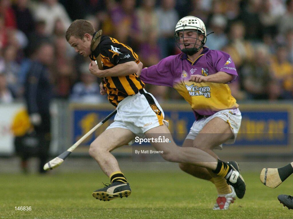 14 July 2004; Tommy Walsh, Kilkenny, in action against Des Mythen, Wexford. Erin Leinster Under 21 Hurling Final, Wexford v Kilkenny, Wexford Park, Wexford. Picture credit; Matt Browne / SPORTSFILE