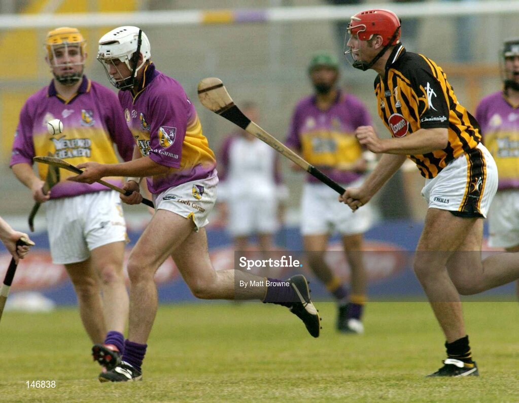 14 July 2004; Cronan Dempsey, Wexford, in action against Peter Cleere, Kilkenny. Erin Leinster Under 21 Hurling Final, Wexford v Kilkenny, Wexford Park, Wexford. Picture credit; Matt Browne / SPORTSFILE