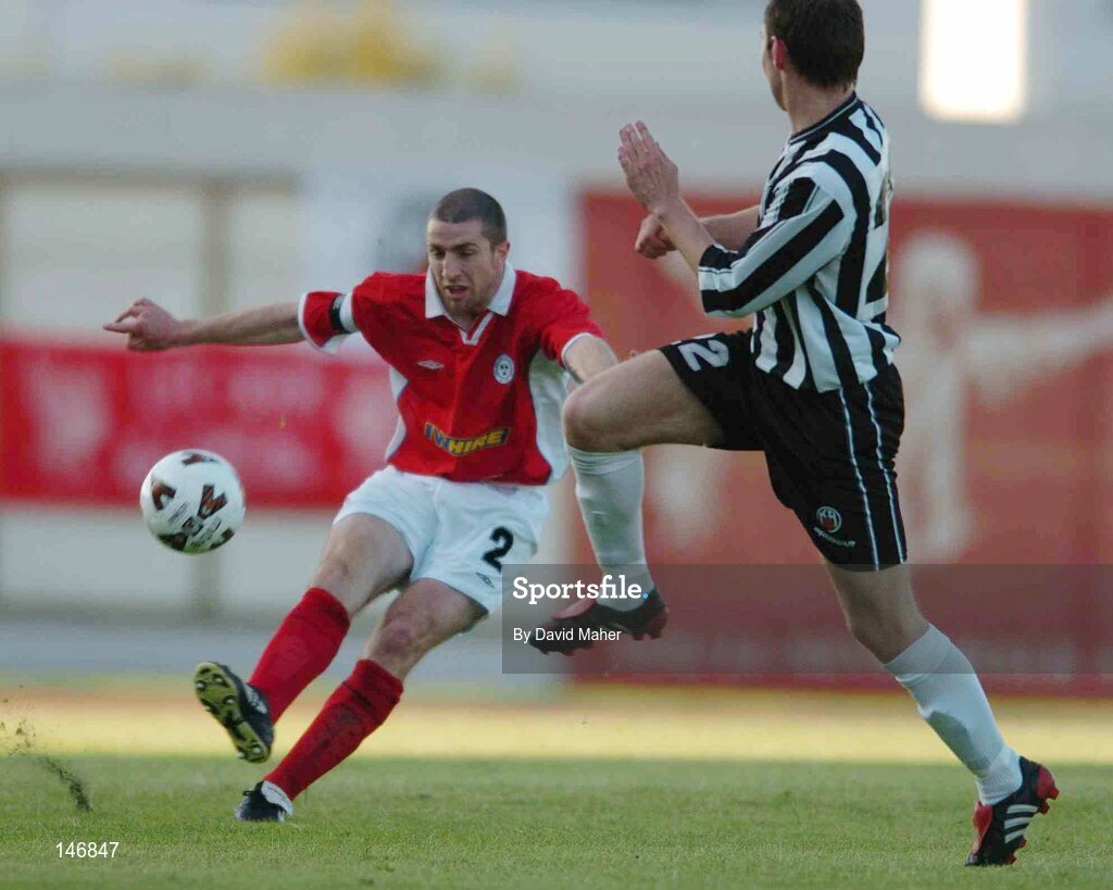14 July 2004; Sigmundur Kristjansson, KR Reykjavik, attempts blocks Owen Heary, Shelbourne. Champions League, Qualifying Round, KR Reykjavik v Shelbourne, KR stadium, Reykjavik, Iceland. Picture credit; David Maher / SPORTSFILE