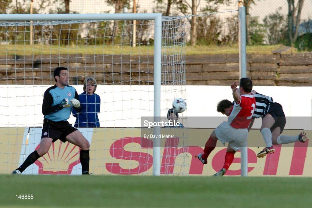 14 July 2004; Sigurvin Olafsson, KR Reykjavik, beats David Crawley, and goalkeeper Steve Williams, Shelbourne, to score his sides second goal. Champions League, Qualifying Round, KR Reykjavik v Shelbourne, KR stadium, Reykjavik, Iceland. Picture credit; David Maher / SPORTSFILE