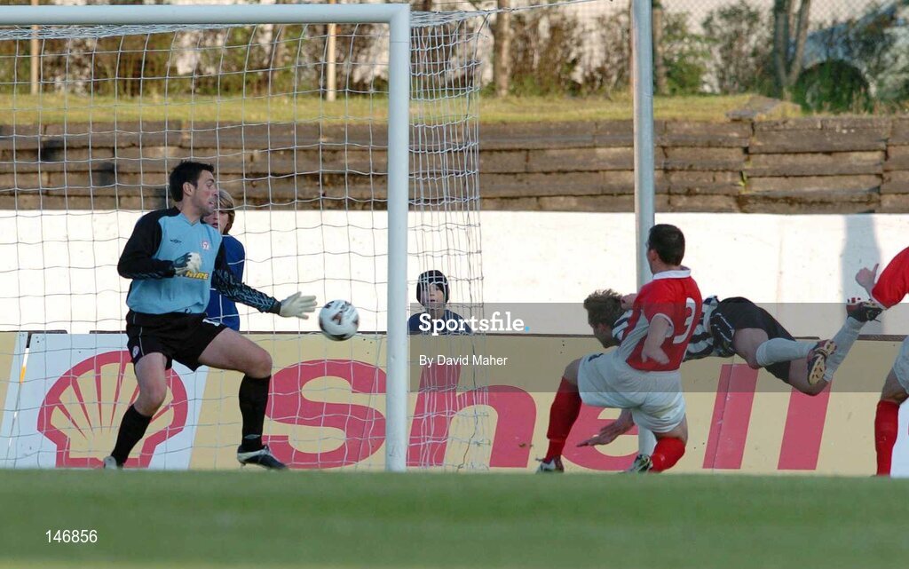 14 July 2004; Sigurvin Olafsson, KR Reykjavik, beats David Crawley, and goalkeeper Steve Williams, Shelbourne, to score his sides second goal. Champions League, Qualifying Round, KR Reykjavik v Shelbourne, KR stadium, Reykjavik, Iceland. Picture credit; David Maher / SPORTSFILE