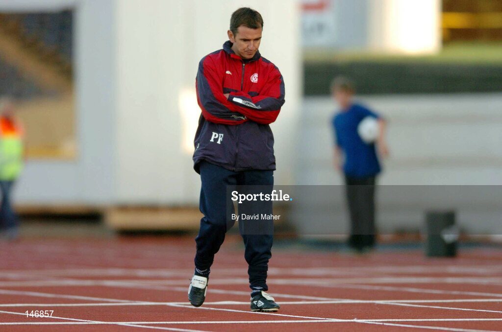 14 July 2004; A disappointed  Shelbourne manager Pat Fenlon looks down as his team trail during the second half. Champions League, Qualifying Round, KR Reykjavik v Shelbourne, KR stadium, Reykjavik, Iceland. Picture credit; David Maher / SPORTSFILE