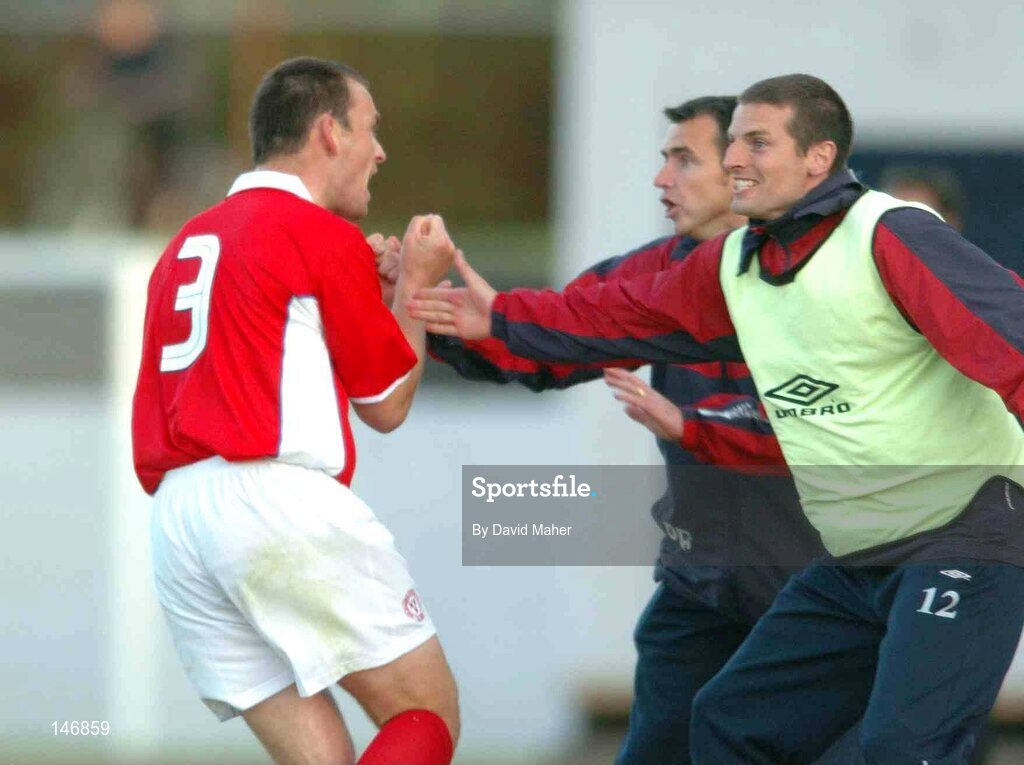 14 July 2004; David Crawley, left, Shelbourne, celebrates after his sides second goal with team-mate Jim Crawford and manager Pat Fenlon. Champions League, Qualifying Round, KR Reykjavik v Shelbourne, KR stadium, Reykjavik, Iceland. Picture credit; David Maher / SPORTSFILE