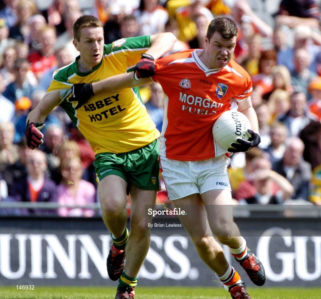 11 July 2004; Ronan Clarke, Armagh, in action against Raymond Sweeney, Donegal. Bank of Ireland Ulster Senior Football Championship Final, Armagh v Donegal, Croke Park, Dublin. Picture credit; Brian Lawless / SPORTSFILE