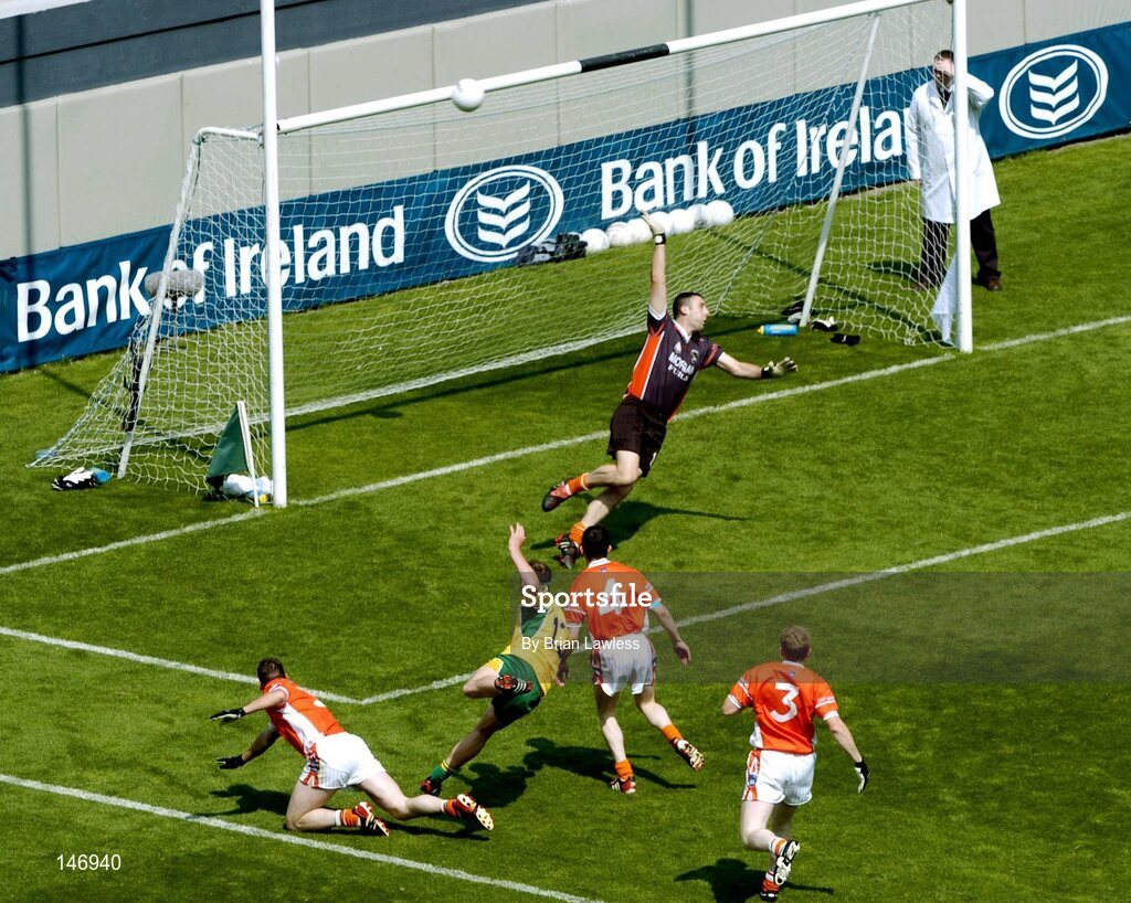 11 July 2004; Donegal's Colm McFadden and Armagh players Francie Bellew (3), Andy Mallon (4), Kieran Hughes, left, and goalkeeper Paul Hearty look on as Colm's shot hits the cross bar. Bank of Ireland Ulster Senior Football Championship Final, Armagh v Donegal, Croke Park, Dublin. Picture credit; Brian Lawless / SPORTSFILE