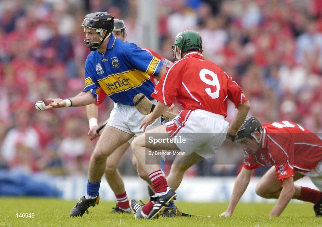 10 July 2004; Colin Morrissey, Tipperary, in action against Jerry O'Connor (9) and John Gardiner, Cork. Guinness Senior Hurling Championship Qualifier, Round 3, Cork v Tipperary, Fitzgerald Stadium, Killarney, Co. Kerry. Picture credit; Brendan Moran / SPORTSFILE