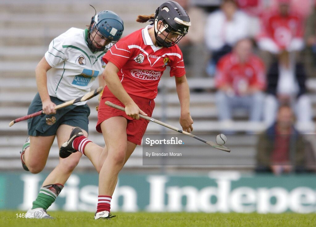 10 July 2004; Una O'Donoghue, Cork, in action against Deirdre Fitzpatrick, Limerick. Foras na Gaeilge Senior Camogie Championship, Cork v Limerick, Fitzgerald Stadium, Killarney, Co. Kerry. Picture credit; Brendan Moran / SPORTSFILE