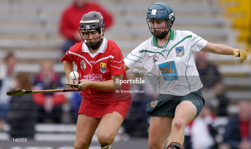 10 July 2004; Una O'Donoghue, Cork, in action against Deirdre Fitzpatrick, Limerick. Foras na Gaeilge Senior Camogie Championship, Cork v Limerick, Fitzgerald Stadium, Killarney, Co. Kerry. Picture credit; Brendan Moran / SPORTSFILE