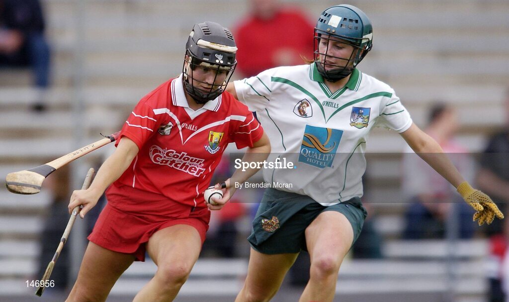 10 July 2004; Una O'Donoghue, Cork, in action against Deirdre Fitzpatrick, Limerick. Foras na Gaeilge Senior Camogie Championship, Cork v Limerick, Fitzgerald Stadium, Killarney, Co. Kerry. Picture credit; Brendan Moran / SPORTSFILE