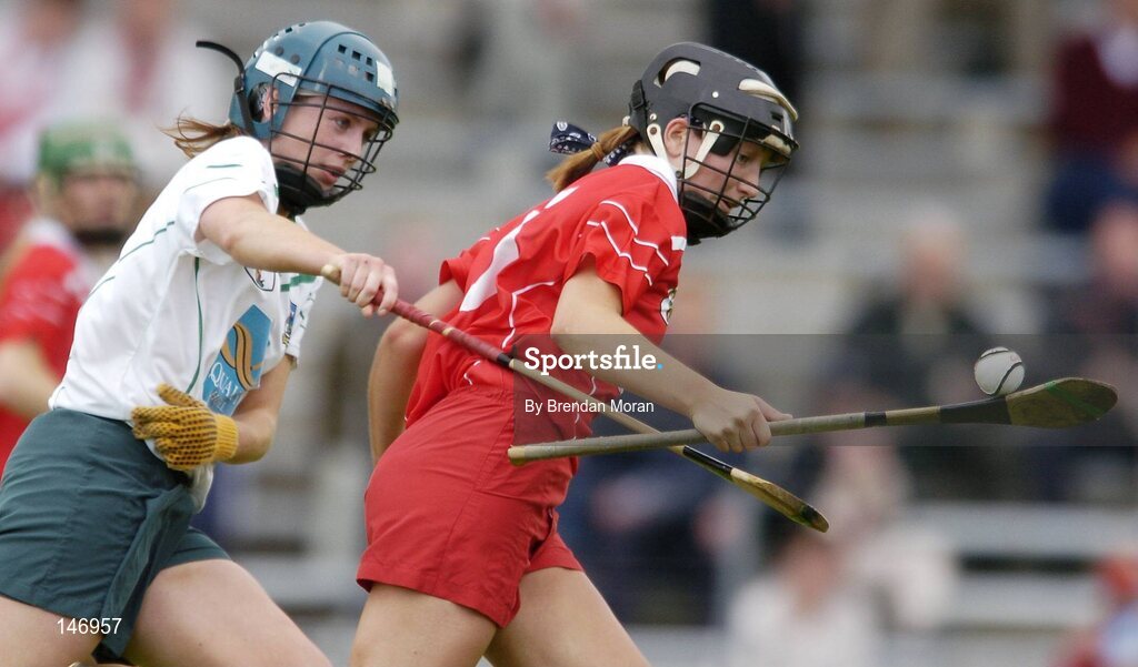 10 July 2004; Una O'Donoghue, Cork, in action against Deirdre Fitzpatrick, Limerick. Foras na Gaeilge Senior Camogie Championship, Cork v Limerick, Fitzgerald Stadium, Killarney, Co. Kerry. Picture credit; Brendan Moran / SPORTSFILE