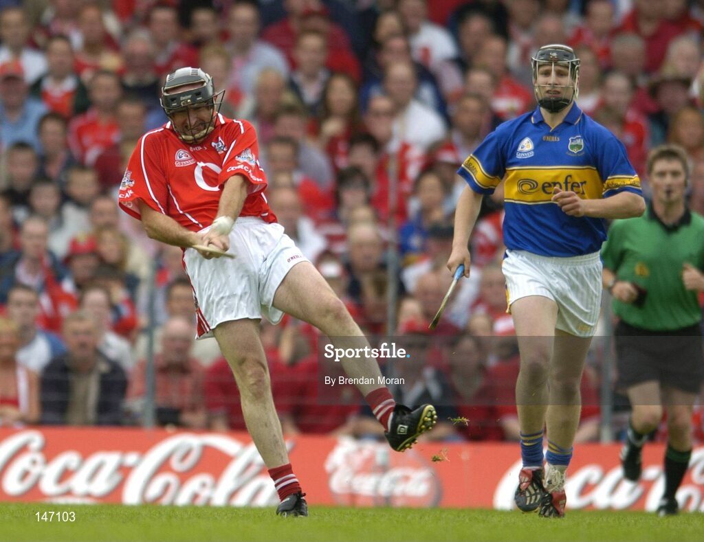 10 July 2004; Brian Corcoran, Cork, in action against Philip Maher, Tipperary. Guinness Senior Hurling Championship Qualifier, Round 3, Cork v Tipperary, Fitzgerald Stadium, Killarney, Co. Kerry. Picture credit; Brendan Moran / SPORTSFILE