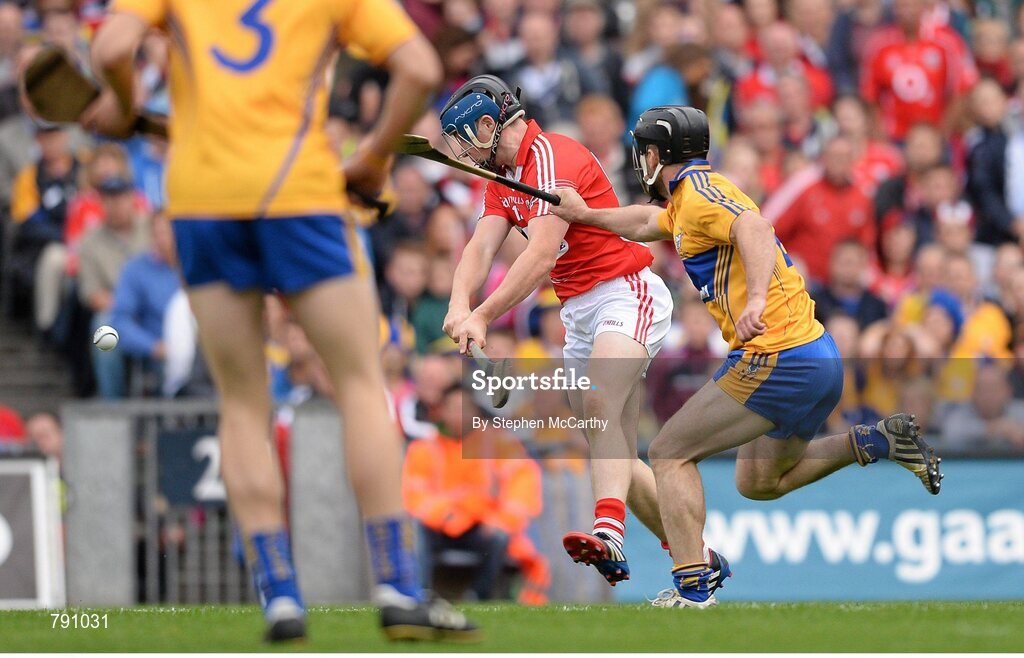 8 September 2013; Conor Lehane, Cork, shoots to score his side's first goal despite the efforts of Clare's Domhnall O'Donovan. GAA Hurling All-Ireland Senior Championship Final, Cork v Clare, Croke Park, Dublin. Picture credit: Stephen McCarthy / SPORTSFILE