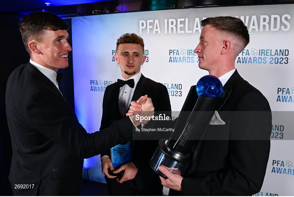 2 December 2023; PFA Ireland Men’s Player of the Year winner Chris Forrester of St Patrick's Athletic, right, is congratulated by teammate Joe Redmond, left, during the PFA Ireland Awards 2023 at Anantara The Marker Dublin Hotel in Dublin. Photo by Stephen McCarthy/Sportsfile