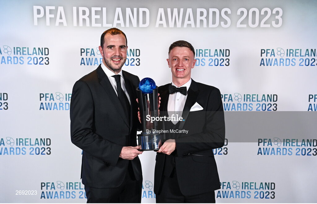 2 December 2023; PFA Ireland Men’s Player of the Year winner Chris Forrester of St Patrick's Athletic, right, with guest of honour John O'Shea during the PFA Ireland Awards 2023 at Anantara The Marker Dublin Hotel in Dublin. Photo by Stephen McCarthy/Sportsfile