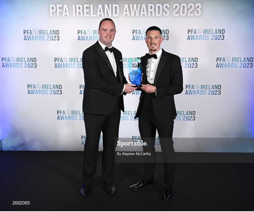 2 December 2023; Ronan Coughlan of Waterford is presented with the PFA Ireland Men’s First Division Player of the Year award by Neil Doyle, left, during the PFA Ireland Awards 2023 at Anantara The Marker Dublin Hotel in Dublin. Photo by Stephen McCarthy/Sportsfile