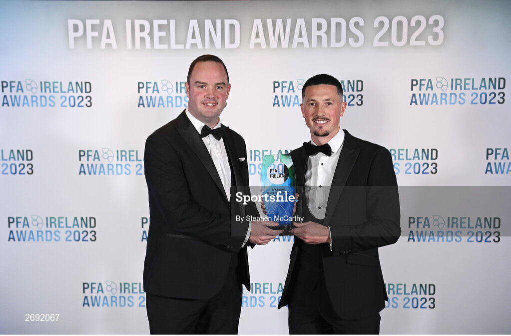 2 December 2023; Ronan Coughlan of Waterford is presented with the PFA Ireland Men’s First Division Player of the Year award by Neil Doyle, left, during the PFA Ireland Awards 2023 at Anantara The Marker Dublin Hotel in Dublin. Photo by Stephen McCarthy/Sportsfile