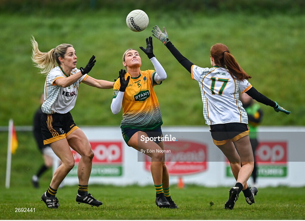 3 December 2023; Clodagh O'Donovan of Glanmire in action against Deirdre Flynn, left, and Emer Fagan of Na Fianna during the Currentaccount.ie LGFA All-Ireland Intermediate Club Championship semi-final match between Glanmire, Cork, and Na Fianna, Meath, at Mallow GAA Grounds in Mallow, Cork. Photo by Eóin Noonan/Sportsfile
