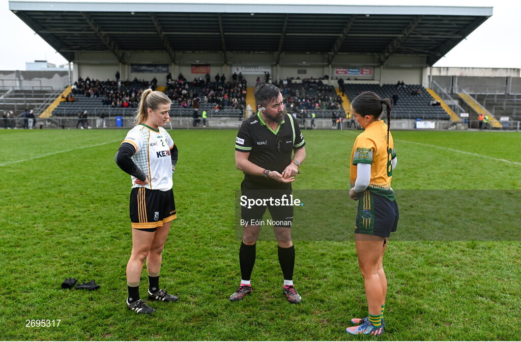 3 December 2023; Referee Seamus Mulvihill with Aedin Slattery of Na Fianna and Ellen Twomey of Glanmire during the Currentaccount.ie LGFA All-Ireland Intermediate Club Championship semi-final match between Glanmire, Cork, and Na Fianna, Meath, at Mallow GAA Grounds in Mallow, Cork. Photo by Eóin Noonan/Sportsfile