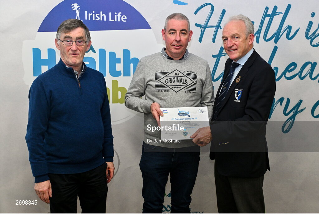 14 December 2023; Castlegar, Galway, representative Philip Madden is presented their Foundation Healthy Club award by Connacht GAA secretary John Prenty, left, and Connacht GAA Council president John Murphy, right, during the Irish Life Connacht GAA Healthy Clubs recognition event at the Connacht GAA Centre of Excellence in Bekan, Mayo. Photo by Ben McShane/Sportsfile