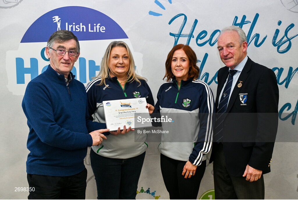 14 December 2023; Tynagh Abbey Duniry, Galway, representatives Deirdre Donnelly and Orlah Fahy is presented their Gold Healthy Club award by Connacht GAA secretary John Prenty, left, and Connacht GAA Council president John Murphy, right, during the Irish Life Connacht GAA Healthy Clubs recognition event at the Connacht GAA Centre of Excellence in Bekan, Mayo. Photo by Ben McShane/Sportsfile