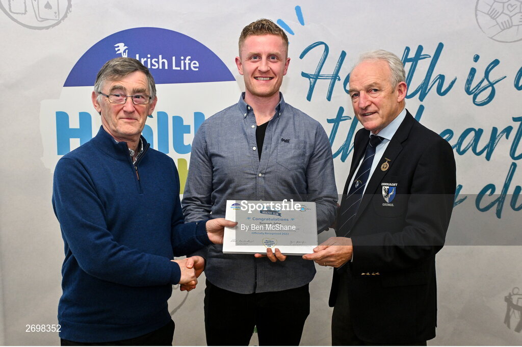 14 December 2023; Bornacoola, Leitrim, representative Allan Croghan is presented their Foundation Healthy Club award by Connacht GAA secretary John Prenty, left, and Connacht GAA Council president John Murphy, right, during the Irish Life Connacht GAA Healthy Clubs recognition event at the Connacht GAA Centre of Excellence in Bekan, Mayo. Photo by Ben McShane/Sportsfile