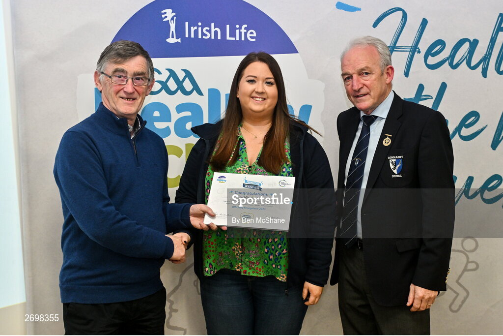 14 December 2023; Gortletteragh, Leitrim, representative Aoife Keenan is presented their Foundation Healthy Club award by Connacht GAA secretary John Prenty, left, and Connacht GAA Council president John Murphy, right, during the Irish Life Connacht GAA Healthy Clubs recognition event at the Connacht GAA Centre of Excellence in Bekan, Mayo. Photo by Ben McShane/Sportsfile