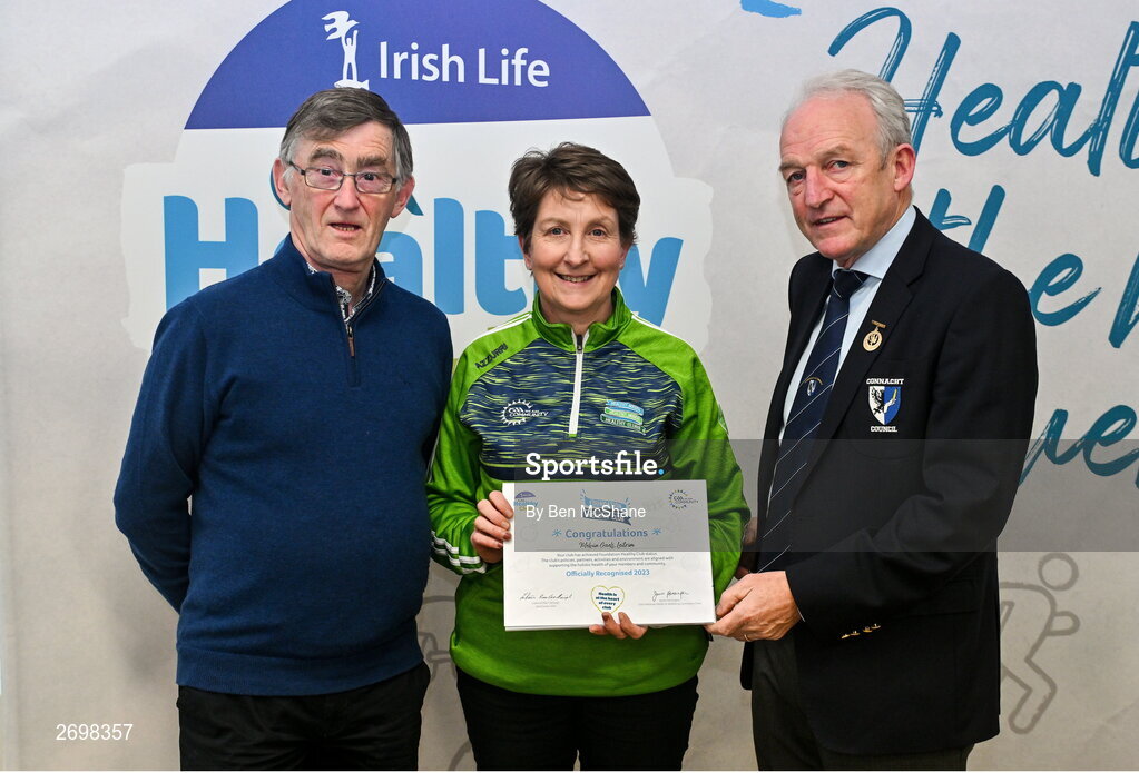 14 December 2023; Melvin Gaels, Leitrim, representative Mary McSharry is presented their Foundation Healthy Club award by Connacht GAA secretary John Prenty, left, and Connacht GAA Council president John Murphy, right, during the Irish Life Connacht GAA Healthy Clubs recognition event at the Connacht GAA Centre of Excellence in Bekan, Mayo. Photo by Ben McShane/Sportsfile