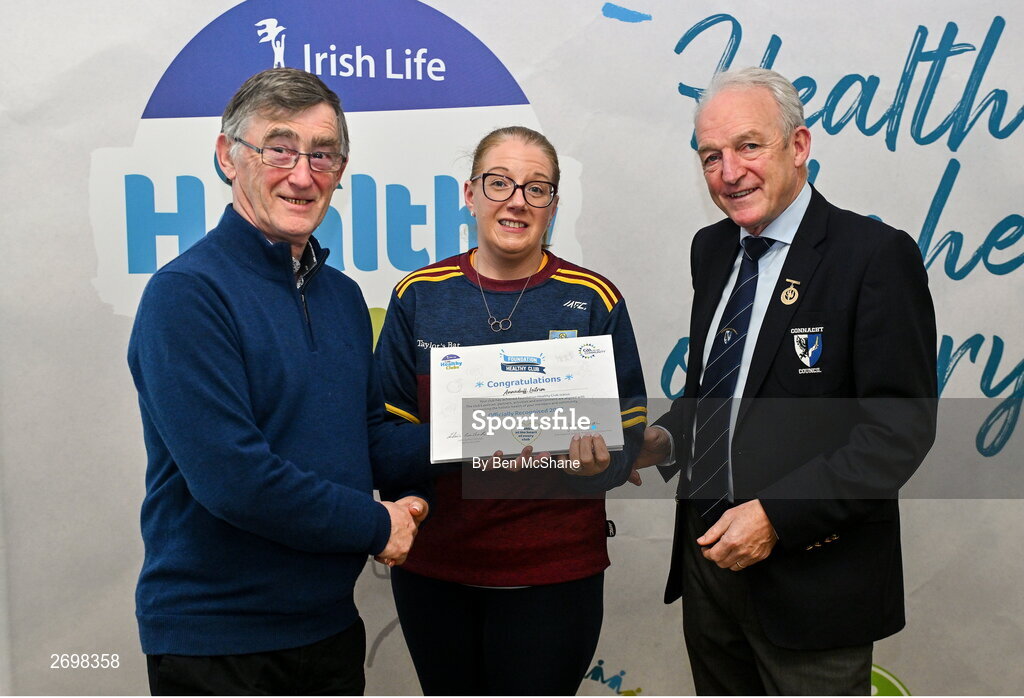 14 December 2023; Annaduff, Leitrim, representative Therese Charles is presented their Foundation Healthy Club award by Connacht GAA secretary John Prenty, left, and Connacht GAA Council president John Murphy, right, during the Irish Life Connacht GAA Healthy Clubs recognition event at the Connacht GAA Centre of Excellence in Bekan, Mayo. Photo by Ben McShane/Sportsfile