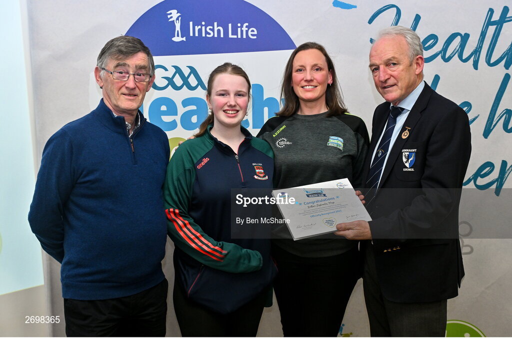 14 December 2023; Ballina Stephnites, Mayo, representatives Fran Downey and Maisie McKeever is presented their Foundation Healthy Club award by Connacht GAA secretary John Prenty, left, and Connacht GAA Council president John Murphy, right, during the Irish Life Connacht GAA Healthy Clubs recognition event at the Connacht GAA Centre of Excellence in Bekan, Mayo. Photo by Ben McShane/Sportsfile