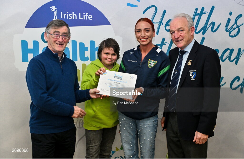 14 December 2023; Mohill, Leitrim, representatives Noah Syder and Charlene Tyrrell is presented their Foundation Healthy Club award by Connacht GAA secretary John Prenty, left, and Connacht GAA Council president John Murphy, right, during the Irish Life Connacht GAA Healthy Clubs recognition event at the Connacht GAA Centre of Excellence in Bekan, Mayo. Photo by Ben McShane/Sportsfile