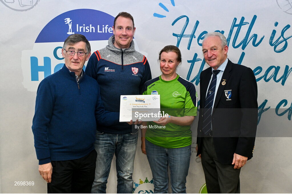 14 December 2023; Bohola Moy Devitts, Mayo, representatives Steve Walsh and Barbera Conlon is presented their Gold Healthy Club award by Connacht GAA secretary John Prenty, left, and Connacht GAA Council president John Murphy, right, during the Irish Life Connacht GAA Healthy Clubs recognition event at the Connacht GAA Centre of Excellence in Bekan, Mayo. Photo by Ben McShane/Sportsfile