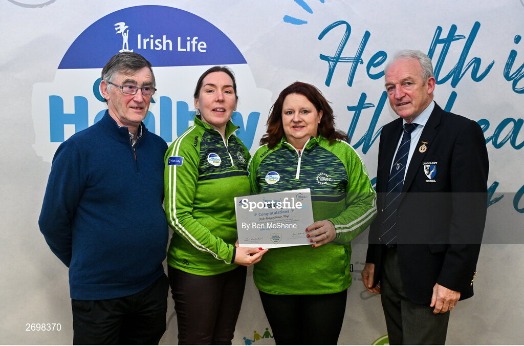 14 December 2023; Parke Keelogues Crimlin, Mayo, representatives Emer O'Toole and Kay O'Donnell is presented their Foundation Healthy Club award by Connacht GAA secretary John Prenty, left, and Connacht GAA Council president John Murphy, right, during the Irish Life Connacht GAA Healthy Clubs recognition event at the Connacht GAA Centre of Excellence in Bekan, Mayo. Photo by Ben McShane/Sportsfile
