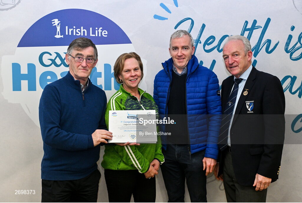 14 December 2023; Hollymount-Carramore, Mayo, representatives Breda McCartan and Matthew Gill is presented their Foundation Healthy Club award by Connacht GAA secretary John Prenty, left, and Connacht GAA Council president John Murphy, right, during the Irish Life Connacht GAA Healthy Clubs recognition event at the Connacht GAA Centre of Excellence in Bekan, Mayo. Photo by Ben McShane/Sportsfile